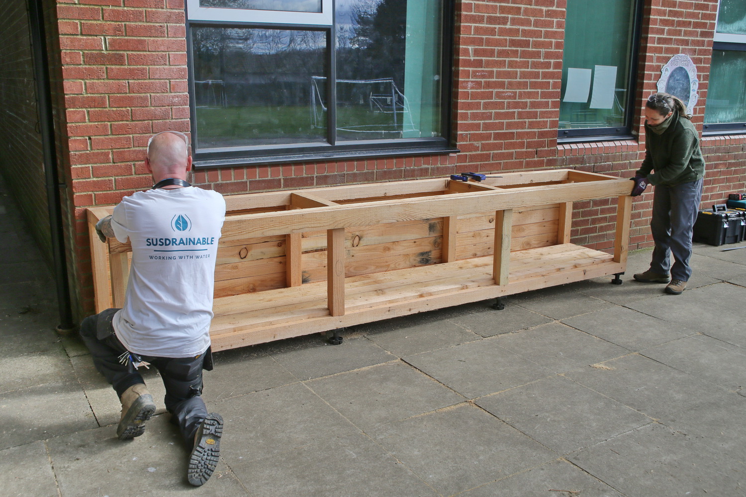 SusDrainable constructing one of the school planters