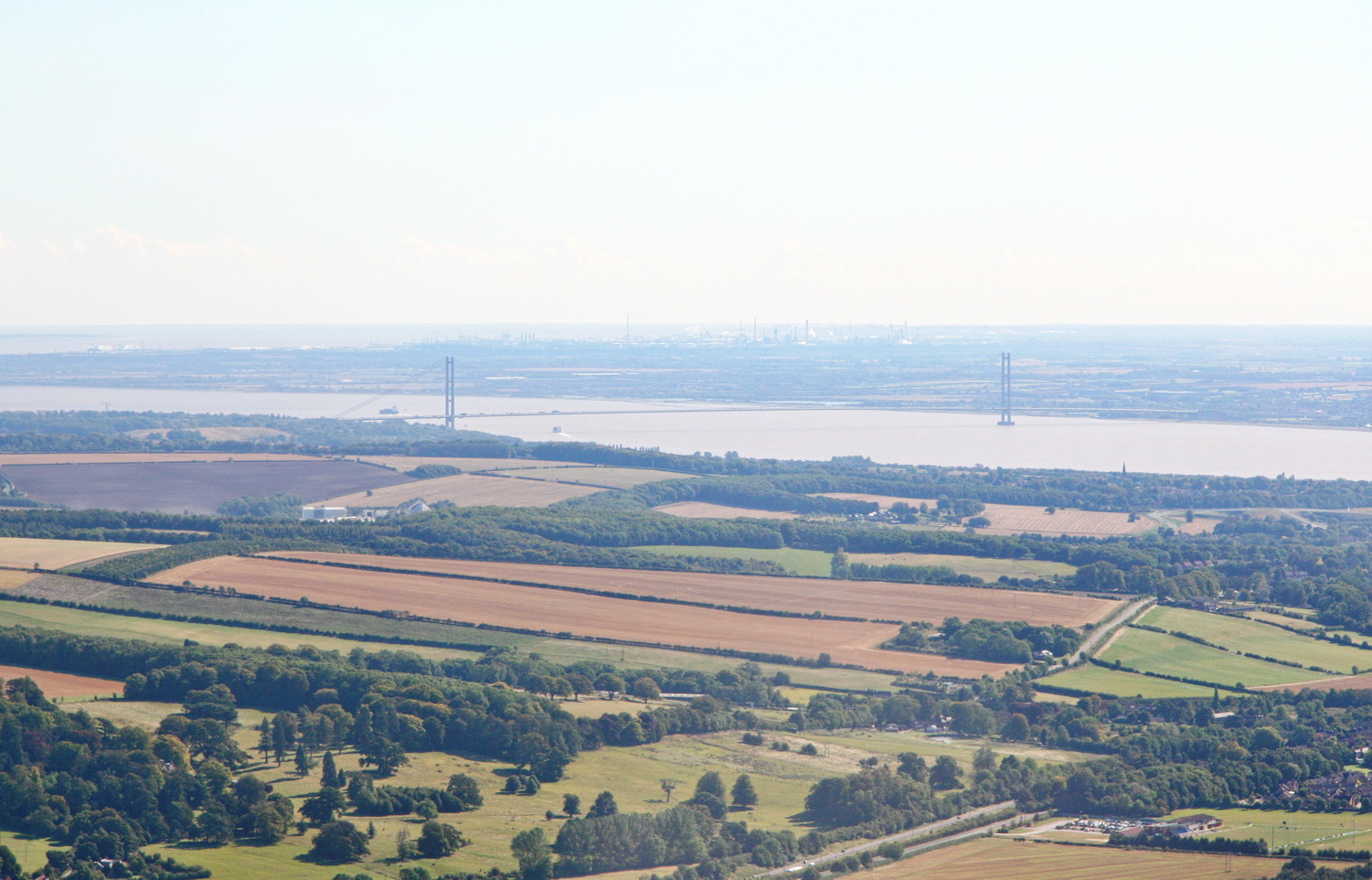 A view of the Humber Bridge, showing tree cover in surrounding countryside